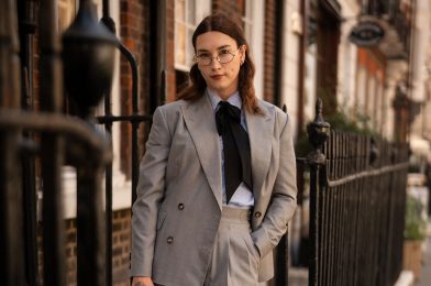 Brit Bones wearing a grey herringbone suit in Dormeuil Pashmina for Look No. 12 of Michael Andrews Bespoke’s 20 for 20 lookbook.
