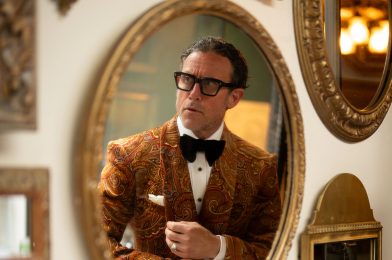 Peter Zottolo reflected in a mirror wearing a bold paisley velvet dinner jacket from Dormeuil’s Celebration collection for MAB’s 20 for 20 lookbook.