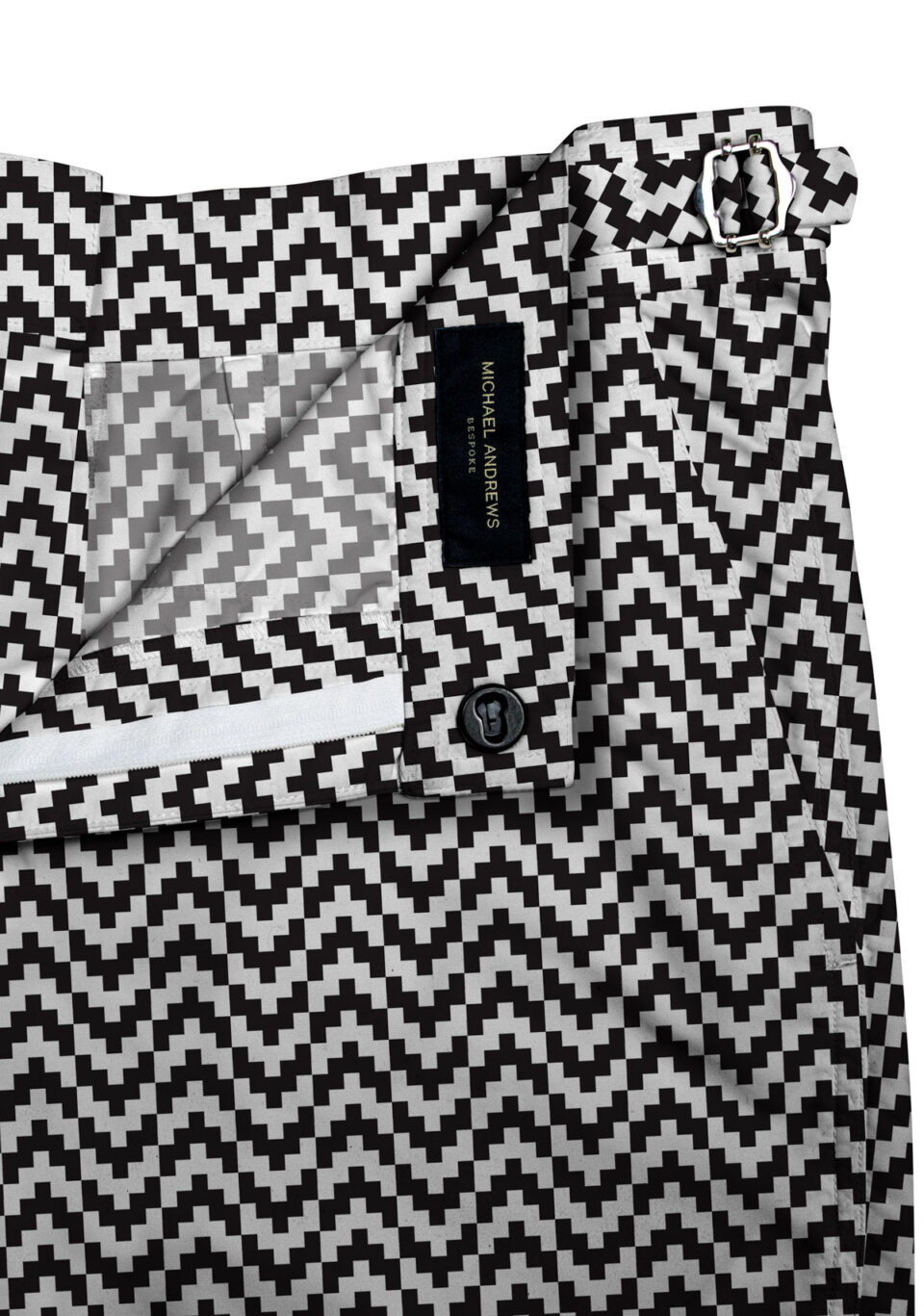 (product) Black & White Zig-Zag Swim Shorts, close-up view showcasing lining and adjustable side tabs - custom suits nyc bespoke tailor midtown, noho
