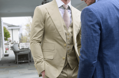 Tan three-piece custom suit with notch lapel, matching waistcoat and tie, styled with a light dress shirt in an outdoor setting, paired with a blue suit, Kentucky Derby style guide. - custom suits nyc bespoke tailor midtown, noho