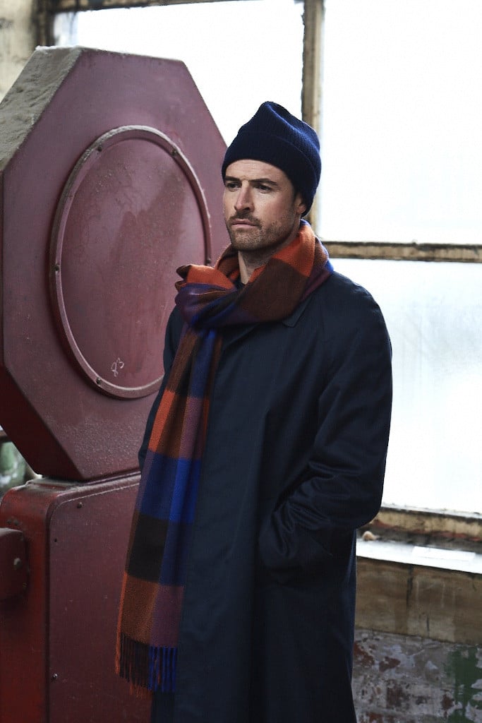 (product) Cobalt Block Check Cashmere Stole, modeled with a navy jacket and beanie - custom suits nyc bespoke tailor midtown, noho