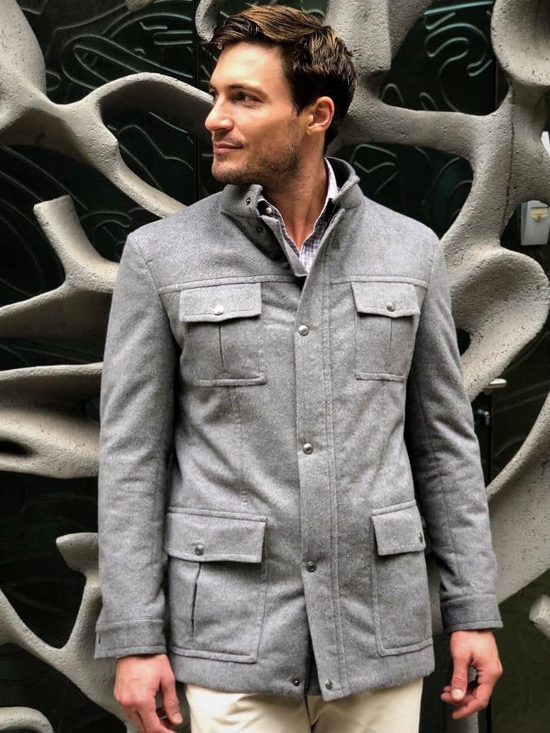 Close-up of a light grey field jacket with buttoned front details - custom suits nyc bespoke tailor midtown, noho