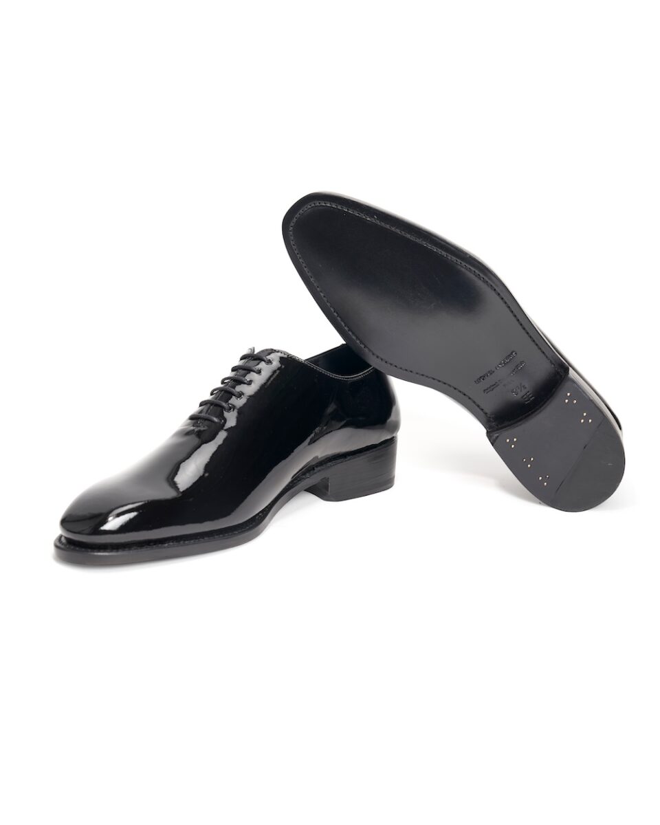 (product) Black Patent Leather Whole Cut Lace-Up, Angled pair view - custom suits nyc bespoke tailor midtown, noho