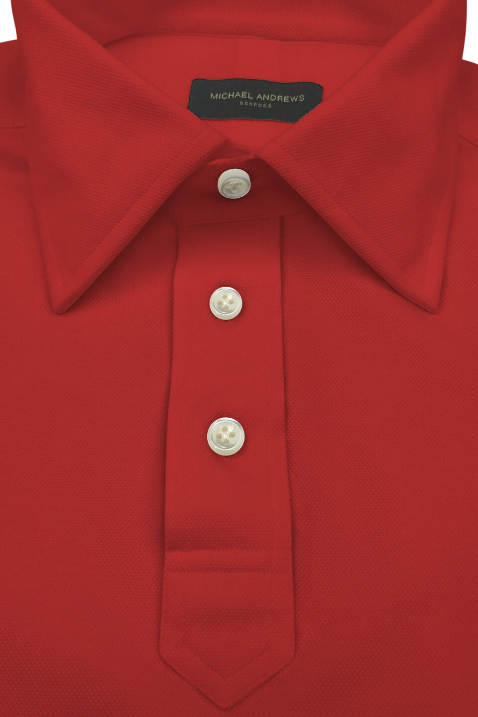(product) Bright Red Pique Polo Shirt, close-up of collar and buttons - custom suits nyc bespoke tailor midtown, noho