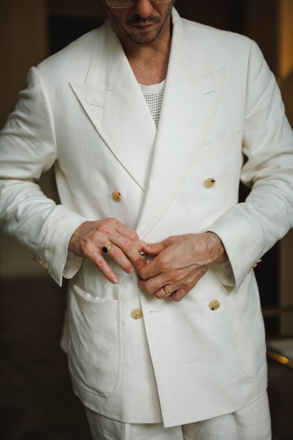Close-up view of Cory in an off white linen suit - custom suits nyc bespoke tailor midtown, noho