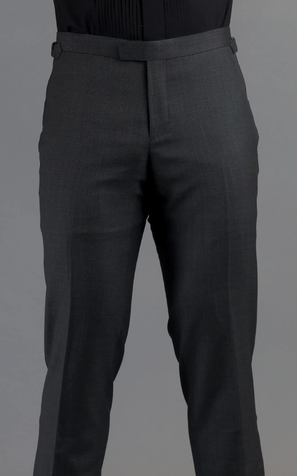 Back view of grey wool MTM tuxedo trousers showcasing the tailored fit