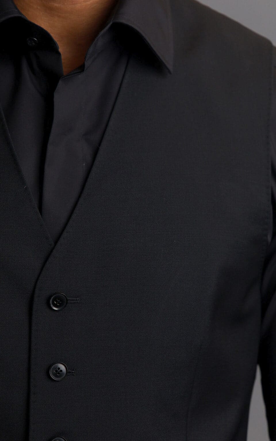 (product) Black Wool/Mohair MTM Suit, close-up of vest