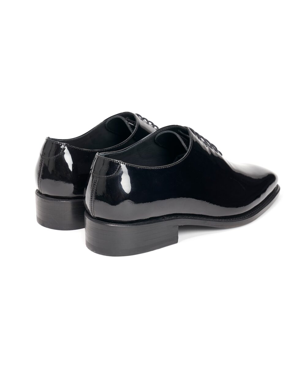 (product) Black Patent Leather Whole Cut Lace-Up, Back view of the pair