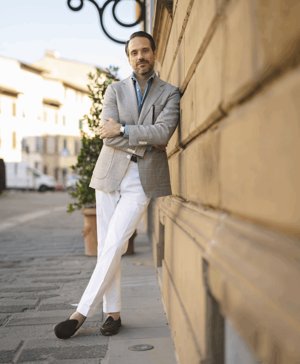 Brian wearing white cotton pants and gray plaid sport coat