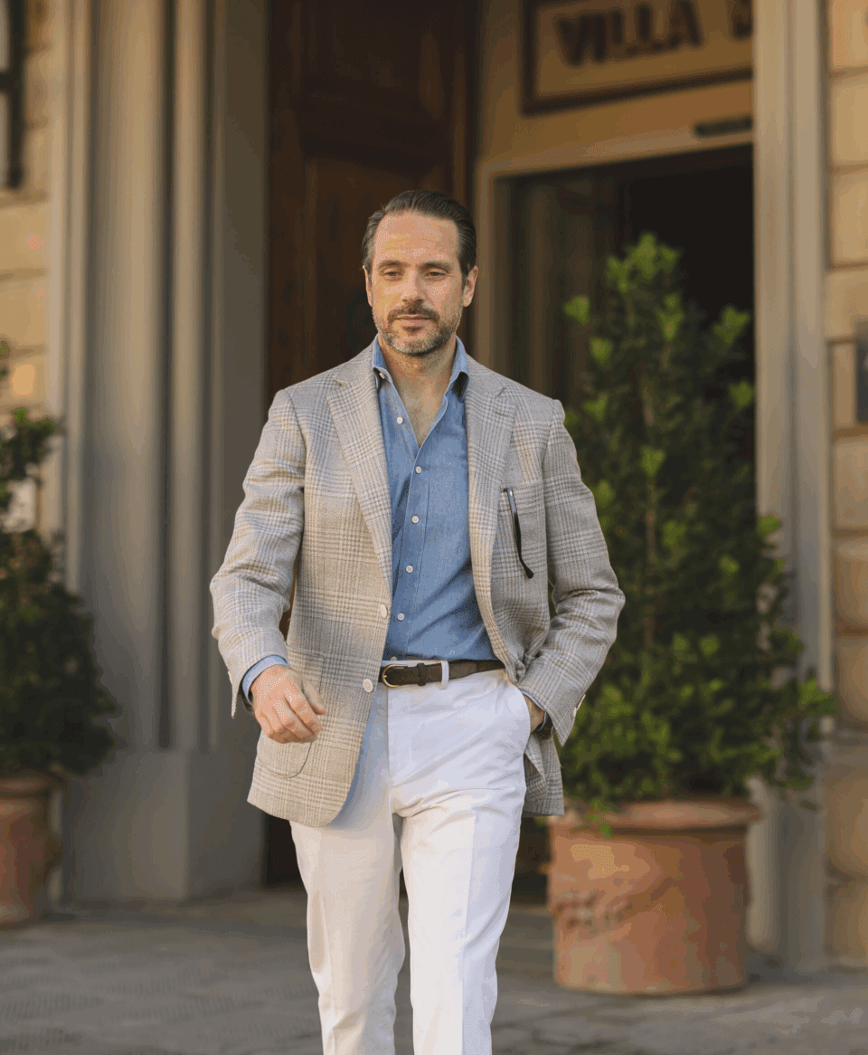 Brian wearing white cotton pants, gray plaid sport coat and blue shirt