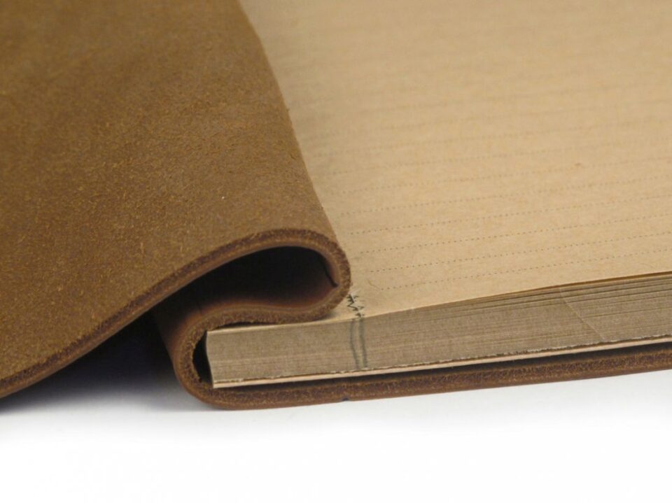(product) Cuba (Tan) La Compagnie du Kraft Leather Notebook, close-up view with detailed stitching