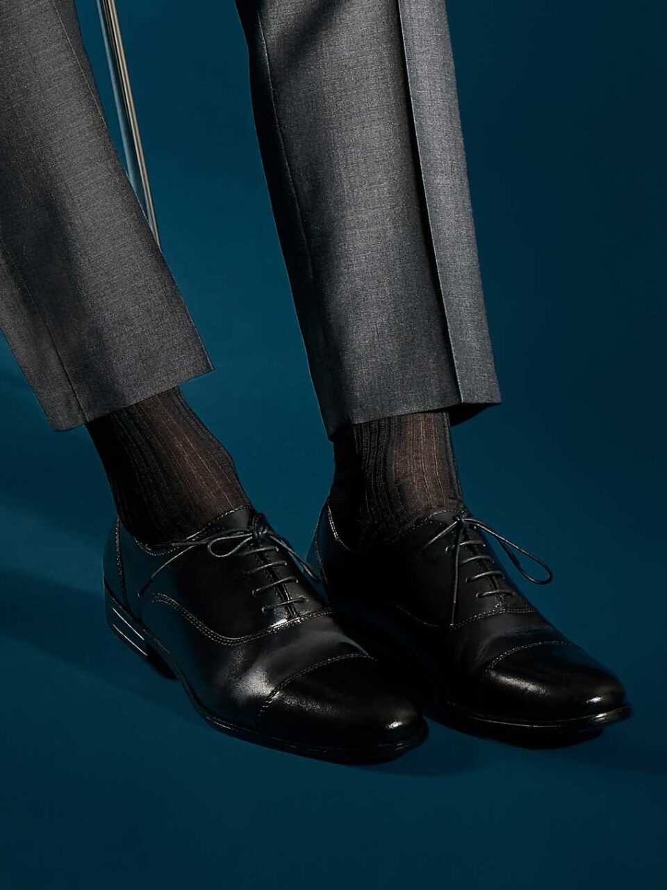 Pantherella Baffin Over-the-Calf Formal Silk Socks, complemented by polished dress shoes and tailored trousers
