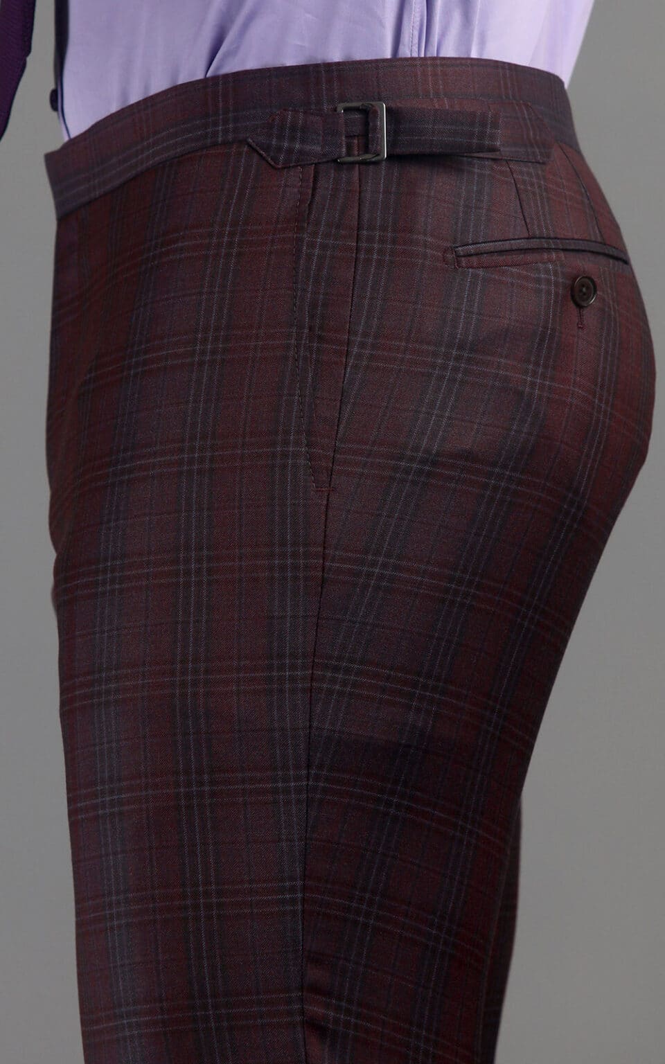 Close-up of maroon plaid MTM suit trousers with side adjuster detail