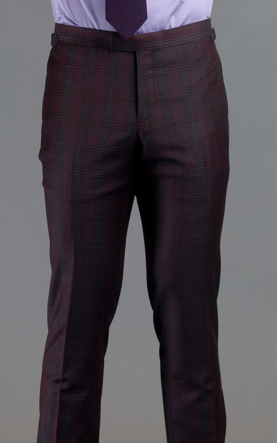 Front view of maroon plaid MTM suit trousers paired with a lilac shirt