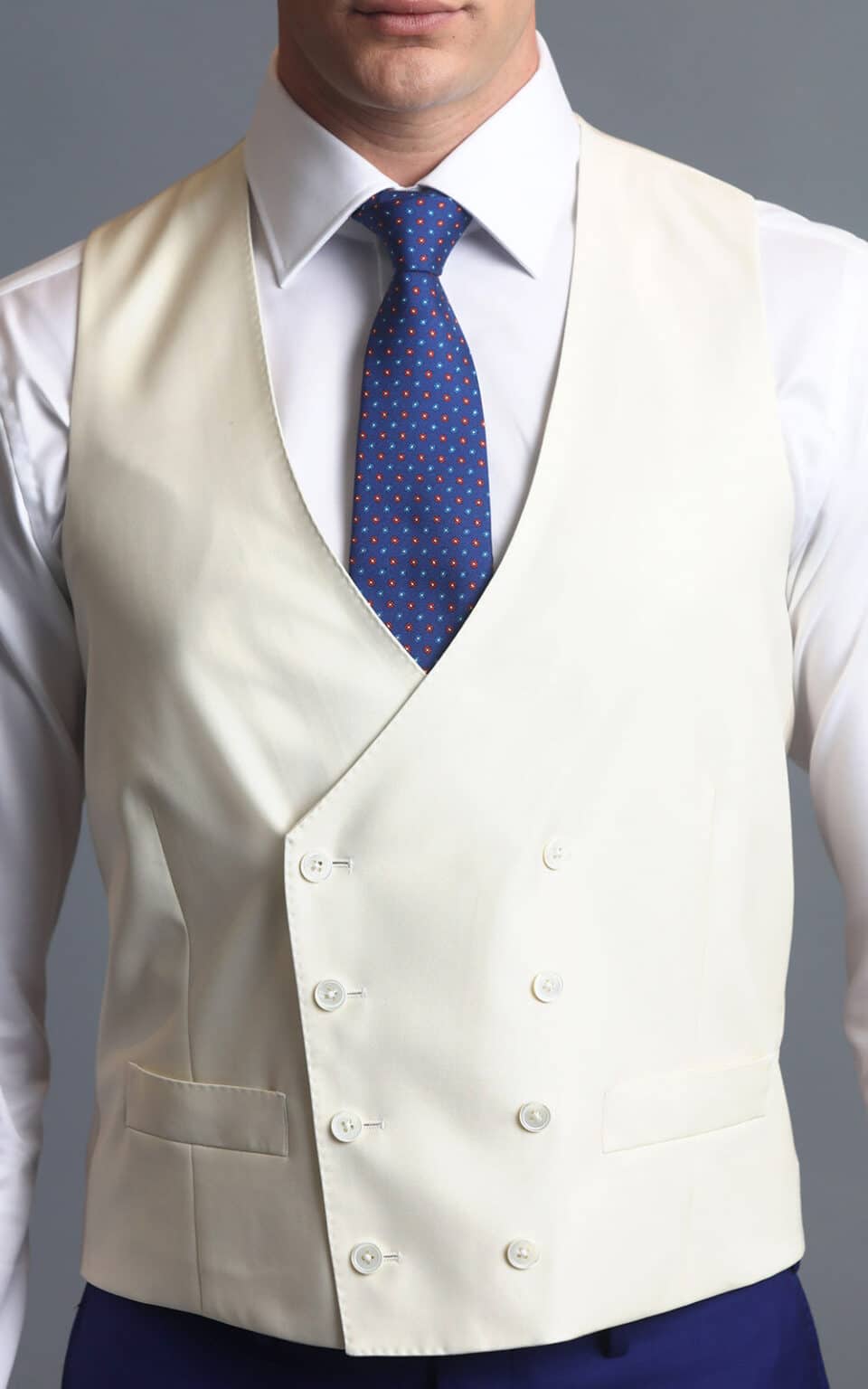 Cream vest paired with a royal blue MTM suit