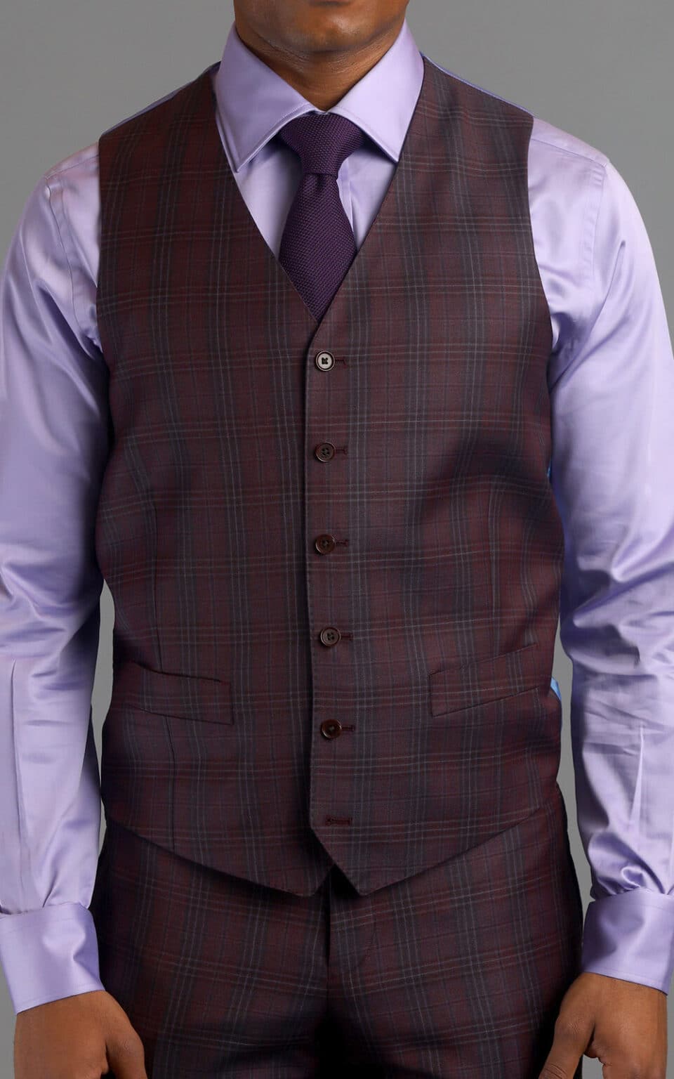 Full view of maroon plaid MTM suit vest paired with a lilac shirt and purple tie