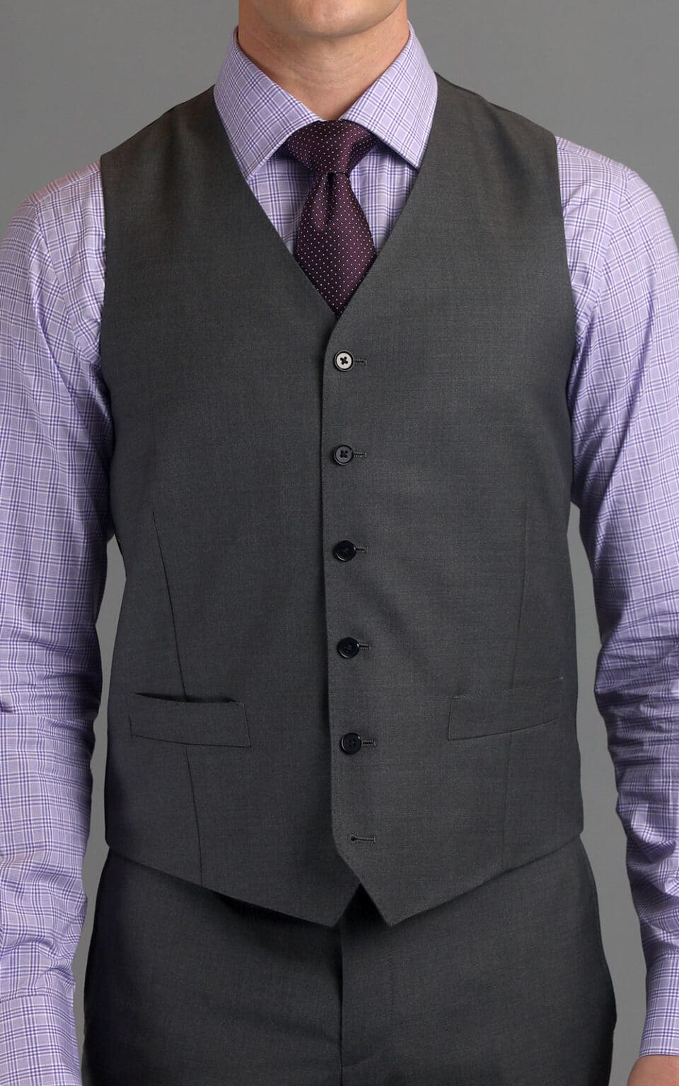 Full view of grey sharkskin MTM suit vest styled with a lilac shirt and burgundy tie