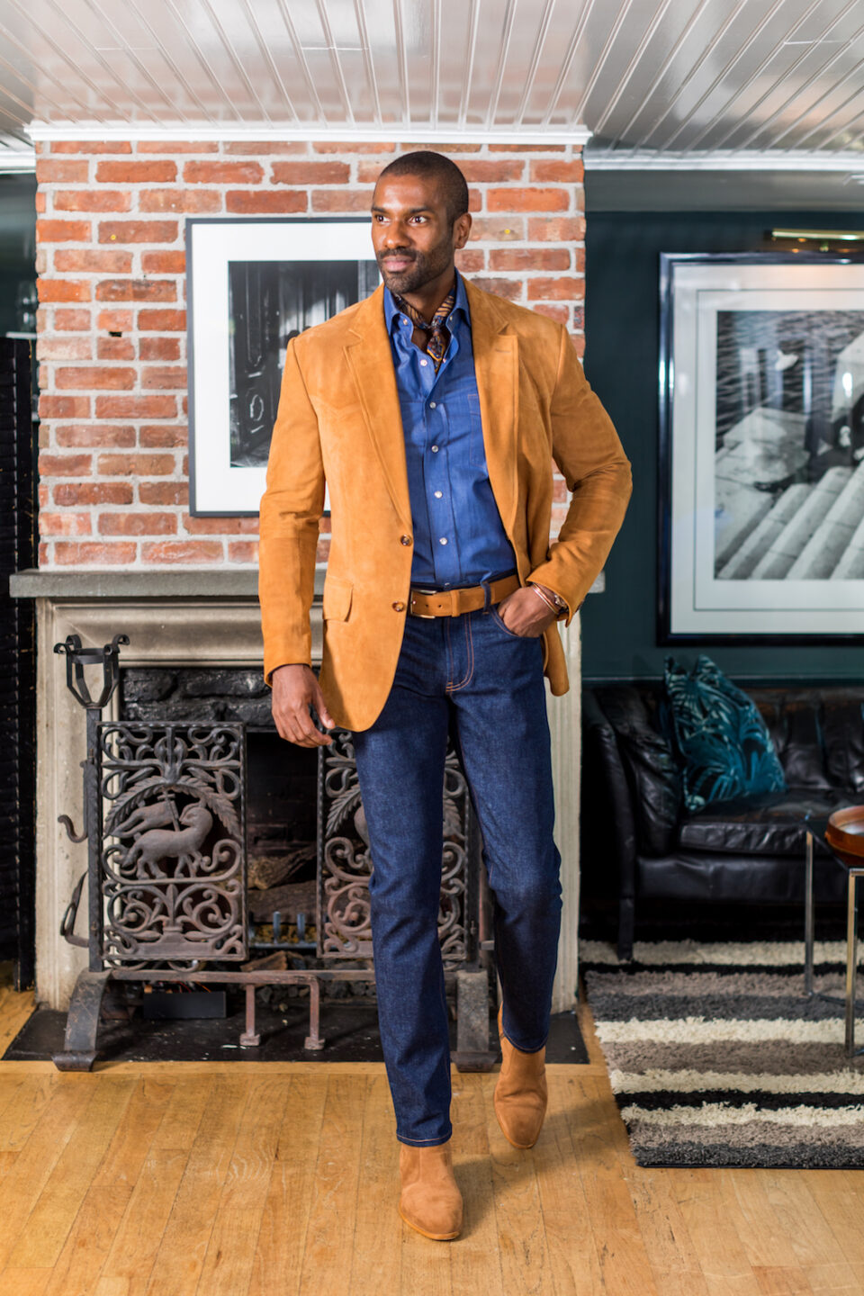 (product) Med Brown Lamb Suede Western Jacket, styled with a denim shirt, paired with dark denim jeans, worn in a cozy indoor setting