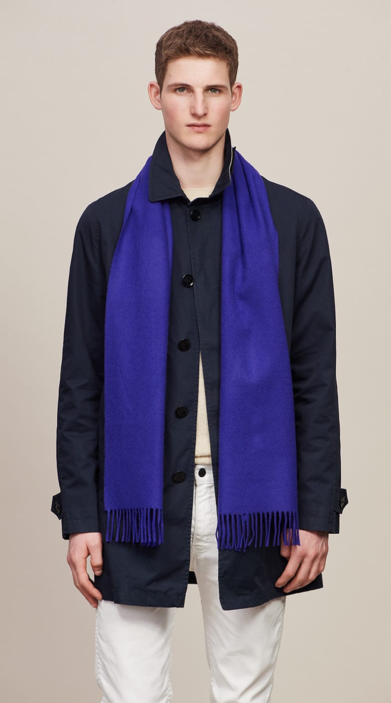 Model wearing a Bright Purple Classic Cashmere Scarf over a black shirt