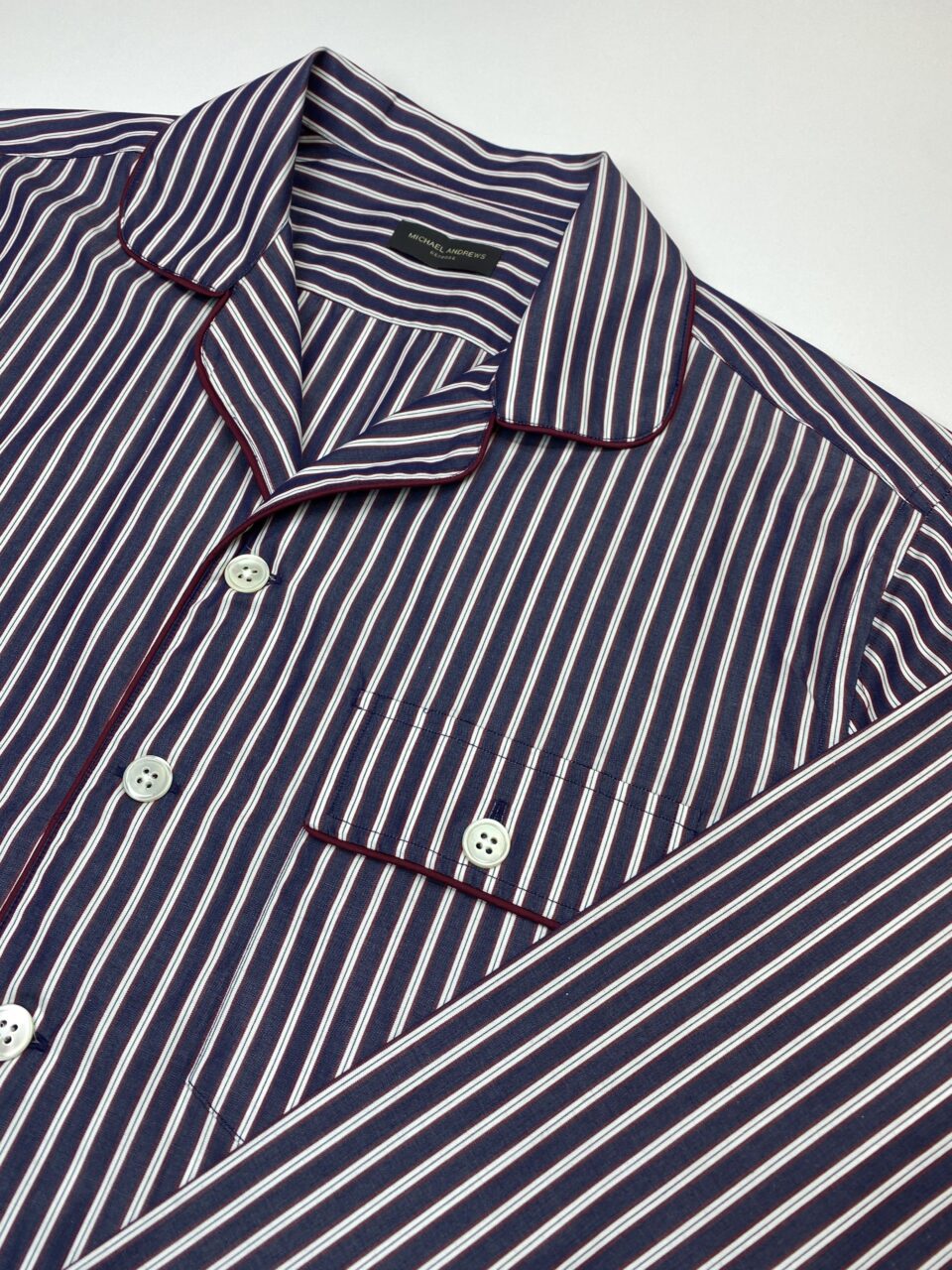 (product) Red & Dark Blue Stripe Pajama Shirt, close-up view, highlighting the buttoned collar