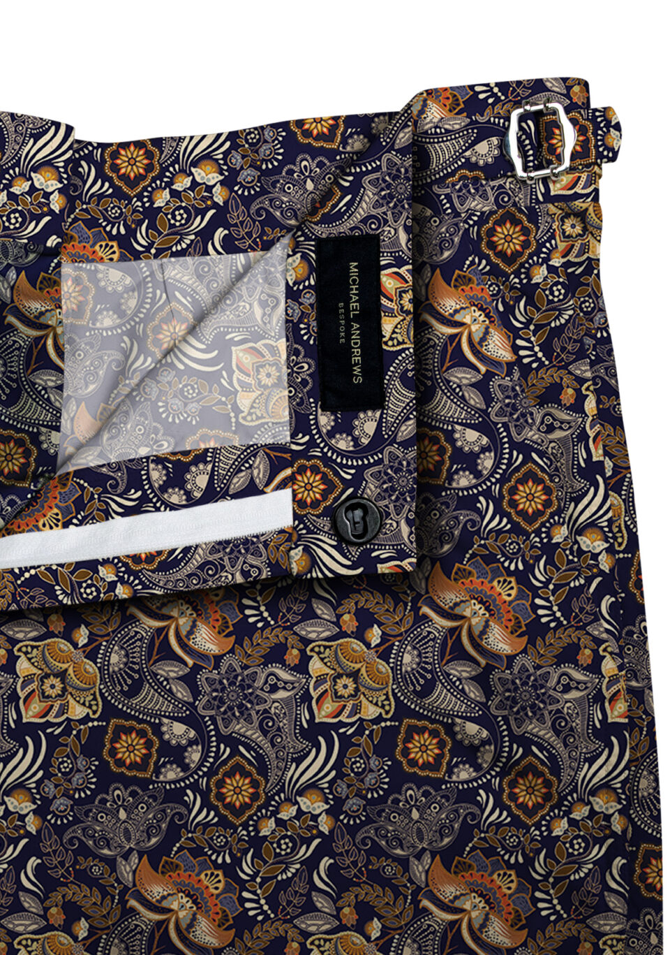 (product) Navy, Orange and Tan Paisley Swim Shorts, close-up view
