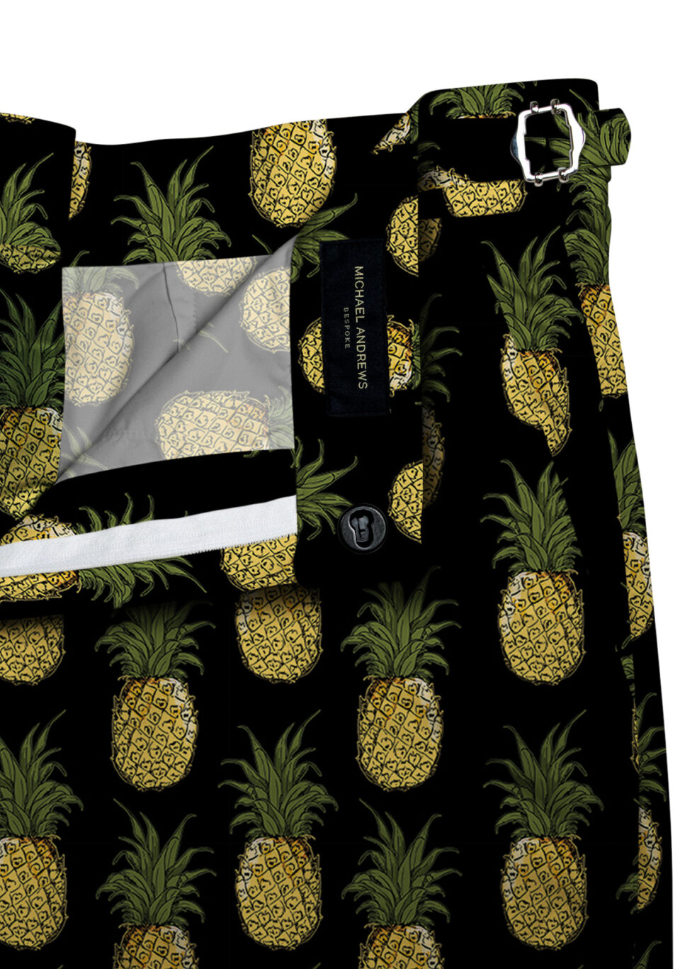 (product) Black with Yellow Pineapples Swim Shorts, close-up view