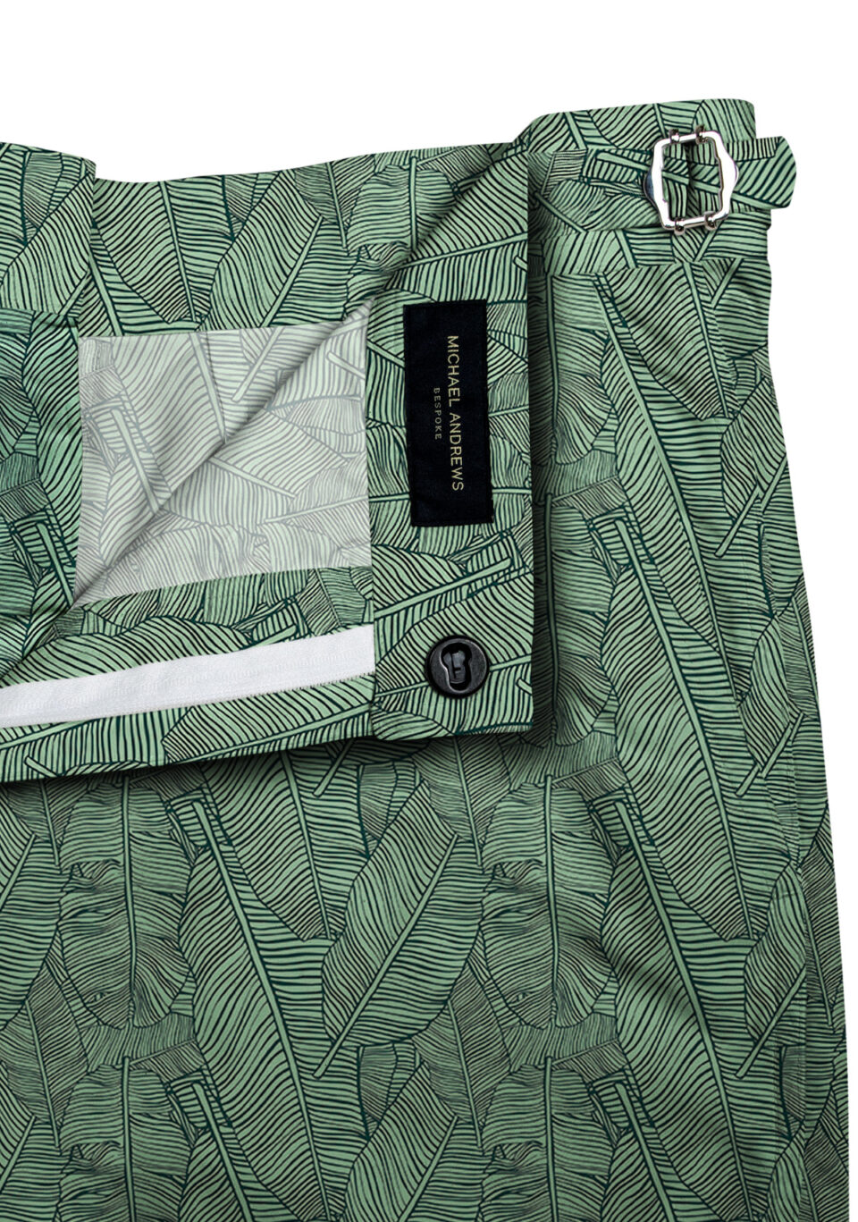 (product) Green Palm Leaves Swim Shorts, close-up view