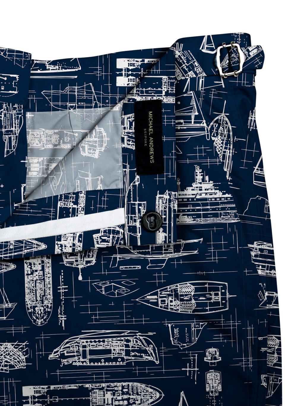 (product) Navy Swim Shorts with White Boats, close-up view highlighting lining and side-tab detail