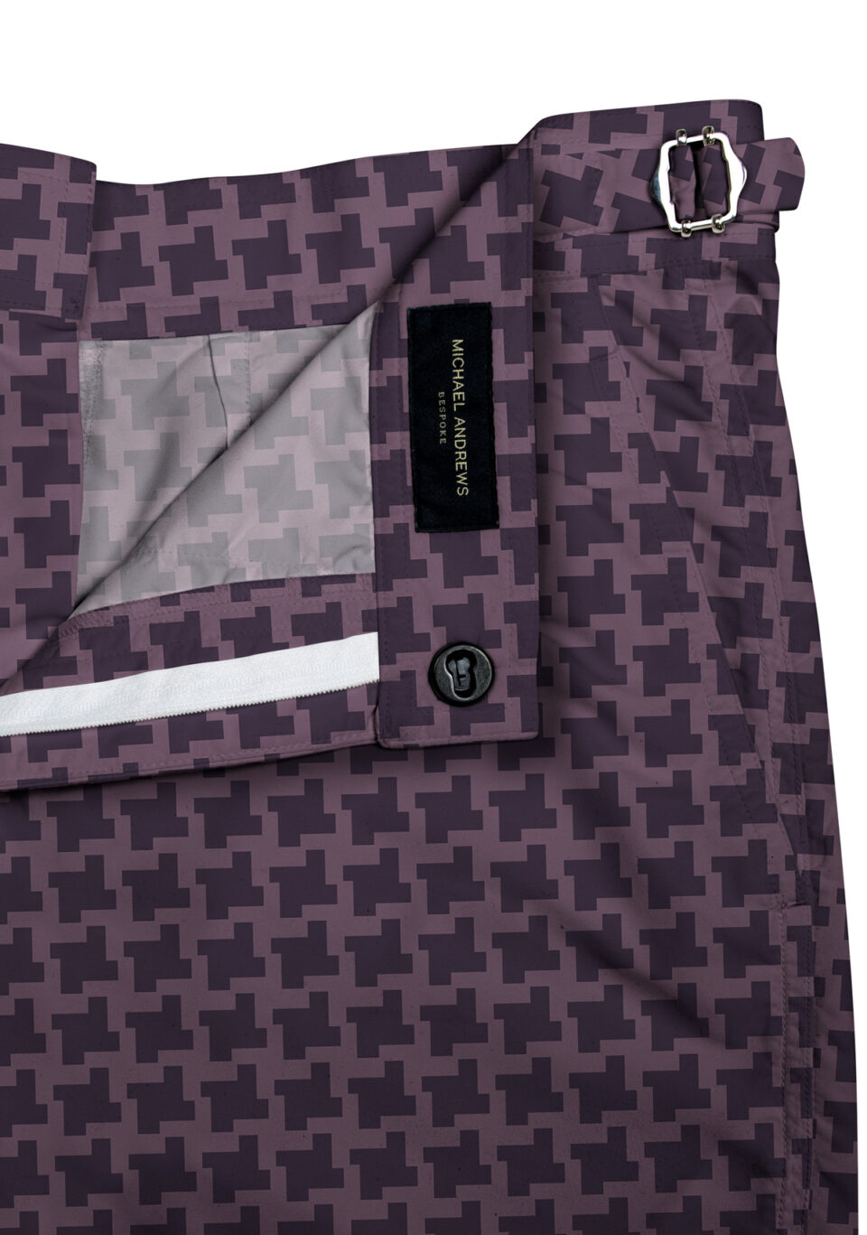(product) Purple Houndstooth Swim Shorts, close-up view showcasing lining and adjustable side tabs