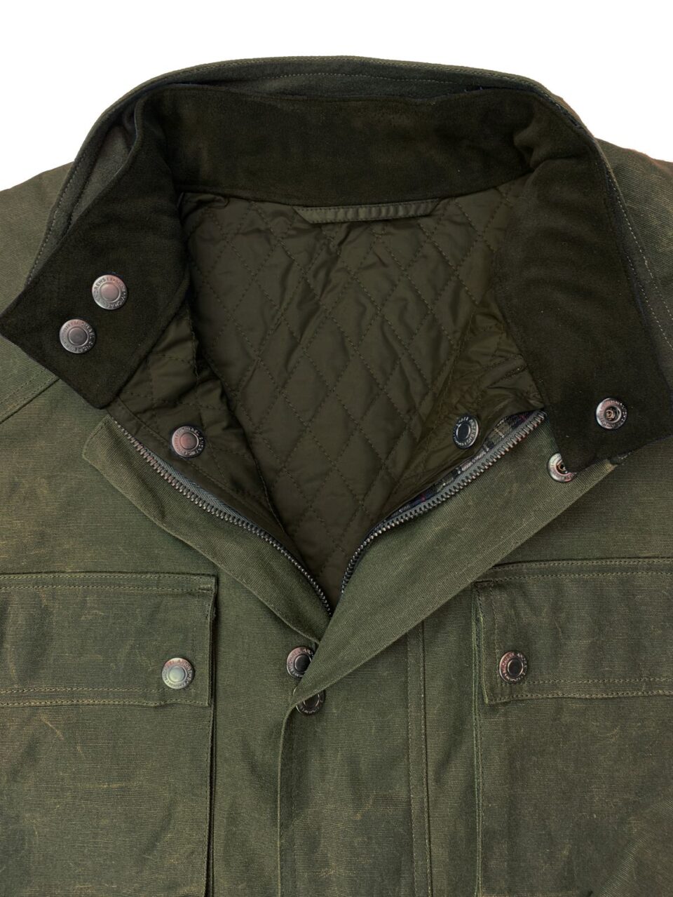 Detail view of a trailmaster jacket showcasing the collar and quilted lining with buttons
