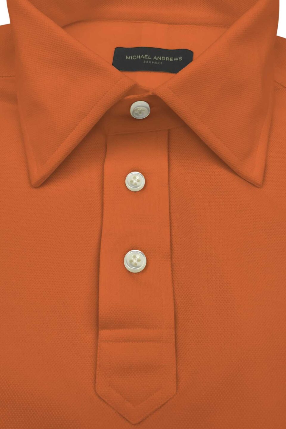 (product) Orange Pique Polo Shirt, close-up of collar and buttons