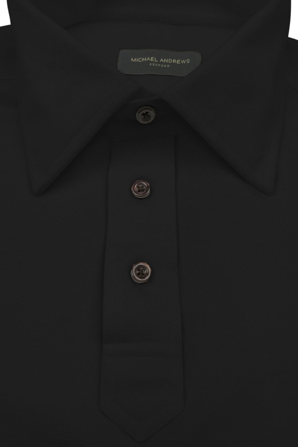 (product) Black Pique Polo Shirt, close-up of collar and buttons