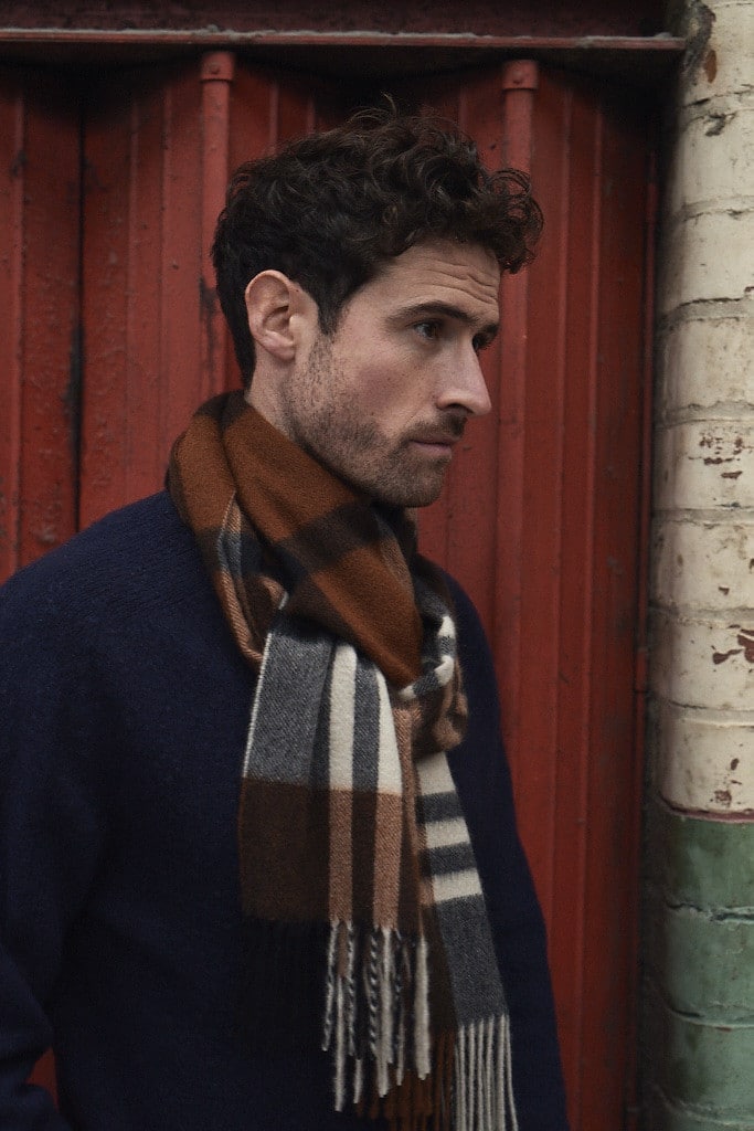 (product) Crocket Primary Blackwatch Wide Cashmere Scarf worn by a model - custom suits nyc bespoke tailor midtown, noho
