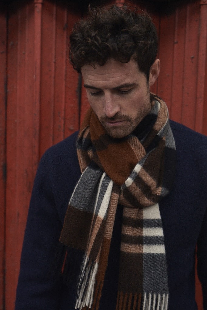 (product) Crocket Primary Blackwatch Wide Cashmere Scarf worn by a model - custom suits nyc bespoke tailor midtown, noho