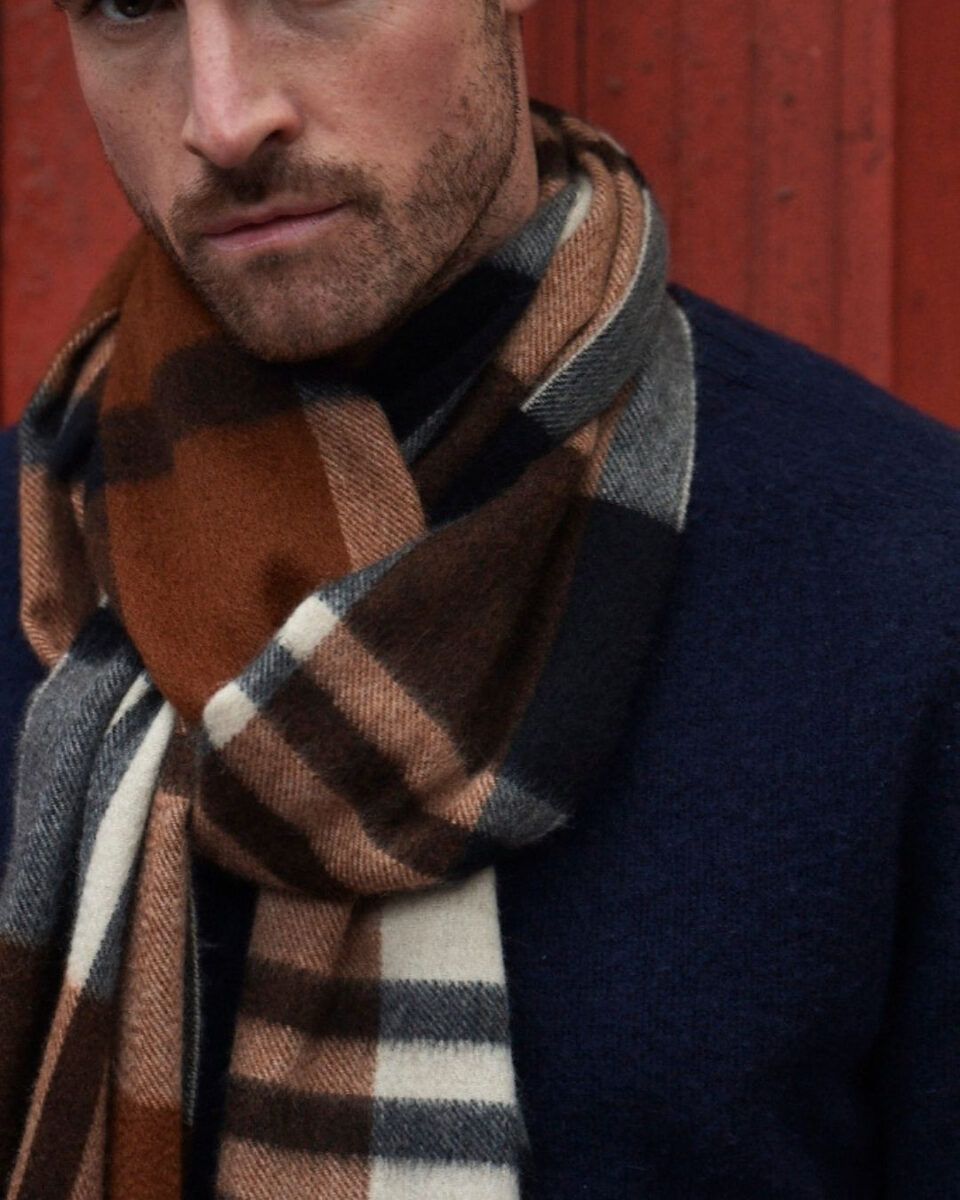 (product) Crocket Primary Blackwatch Wide Cashmere Scarf worn by a model - custom suits nyc bespoke tailor midtown, noho