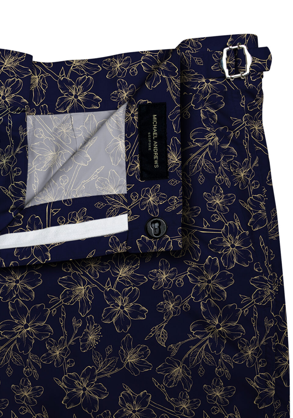 (product) Navy with Tonal Gold Flowers Swim Shorts, close-up view - custom suits nyc bespoke tailor midtown, noho