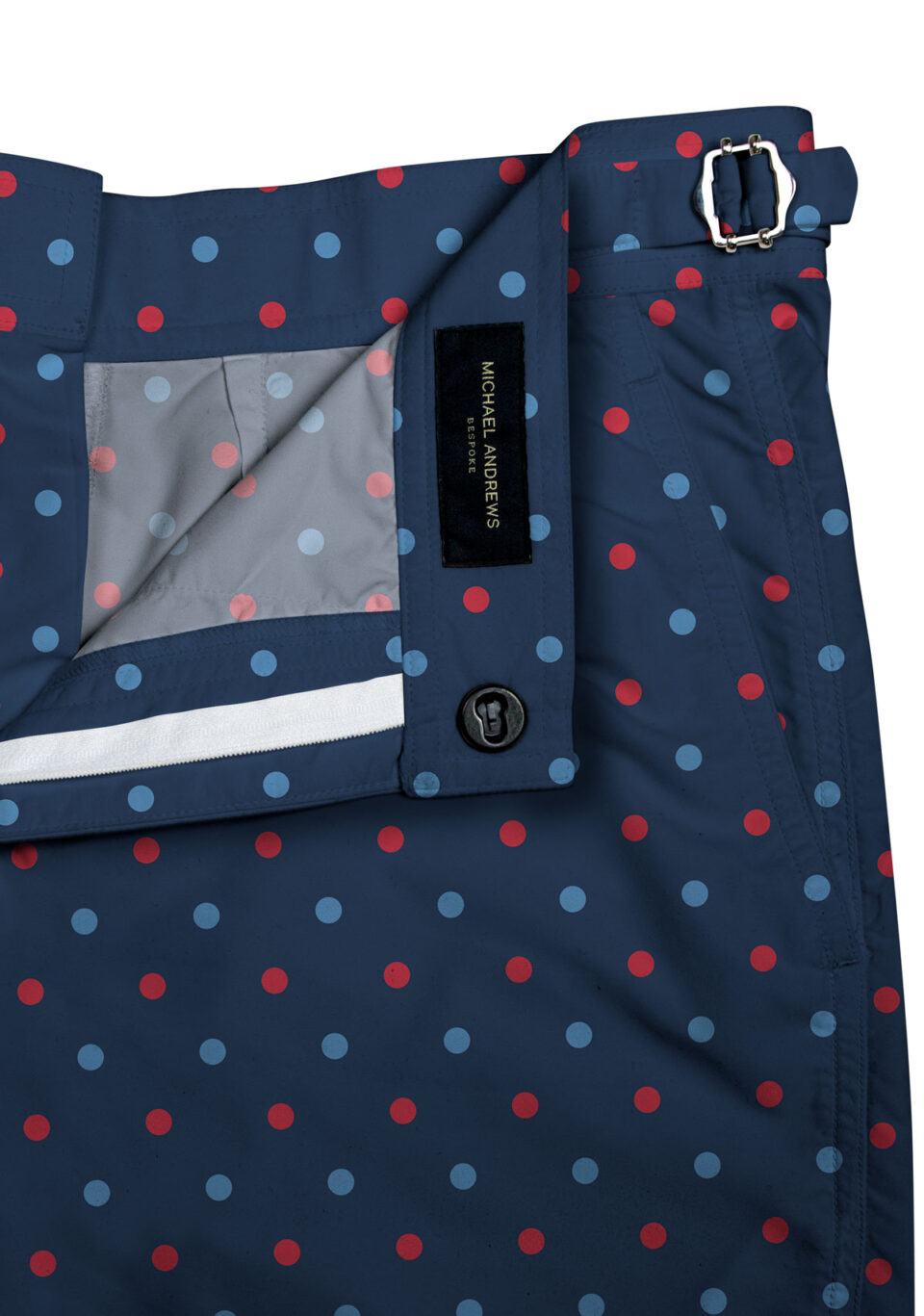 (product) Blue/Red Polka Dots on Navy Swim Shorts, close-up of waistband details - custom suits nyc bespoke tailor midtown, noho