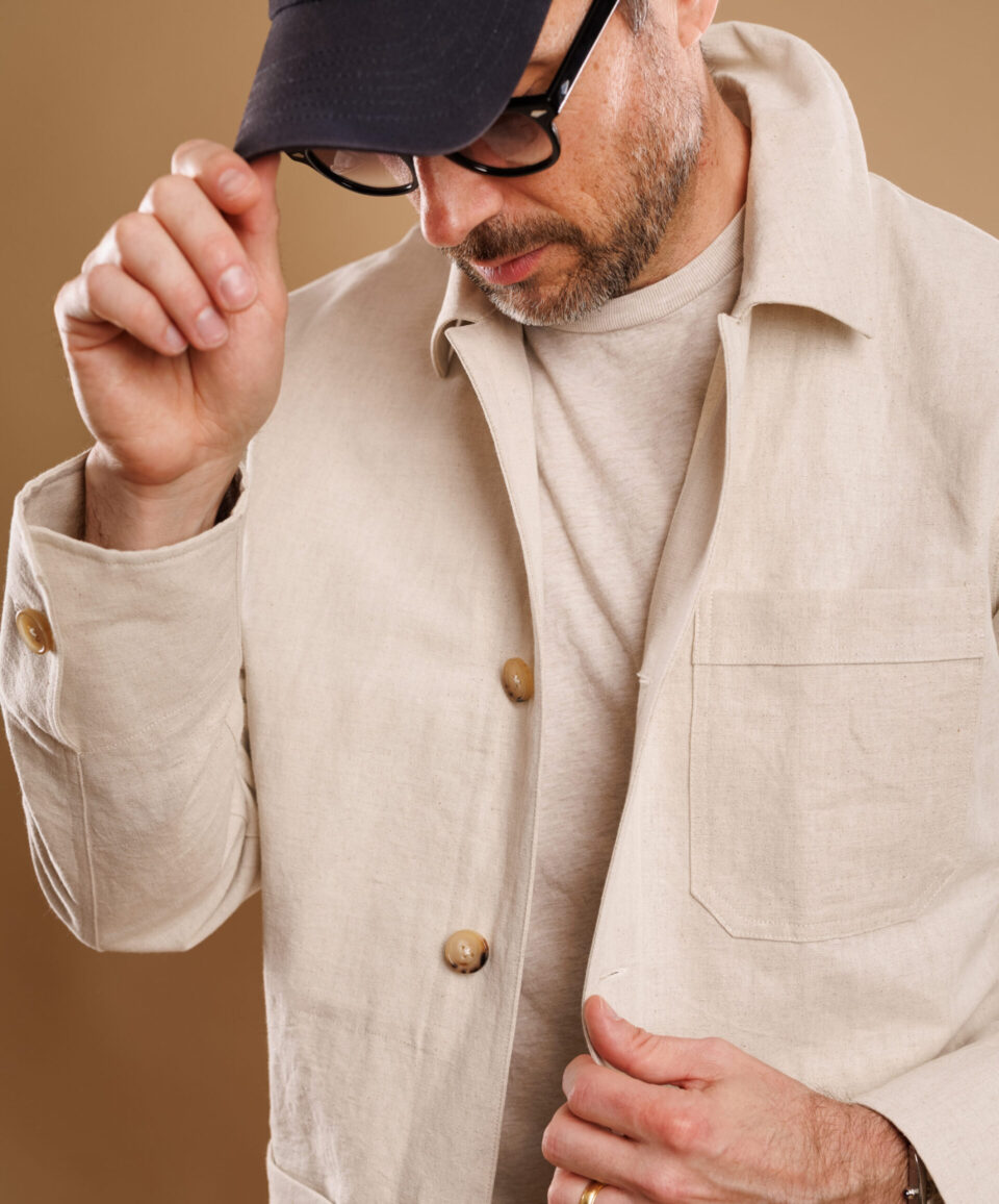 Close-up of man in a natural cotton-linen canvas chore coat - custom suits nyc bespoke tailor midtown, noho