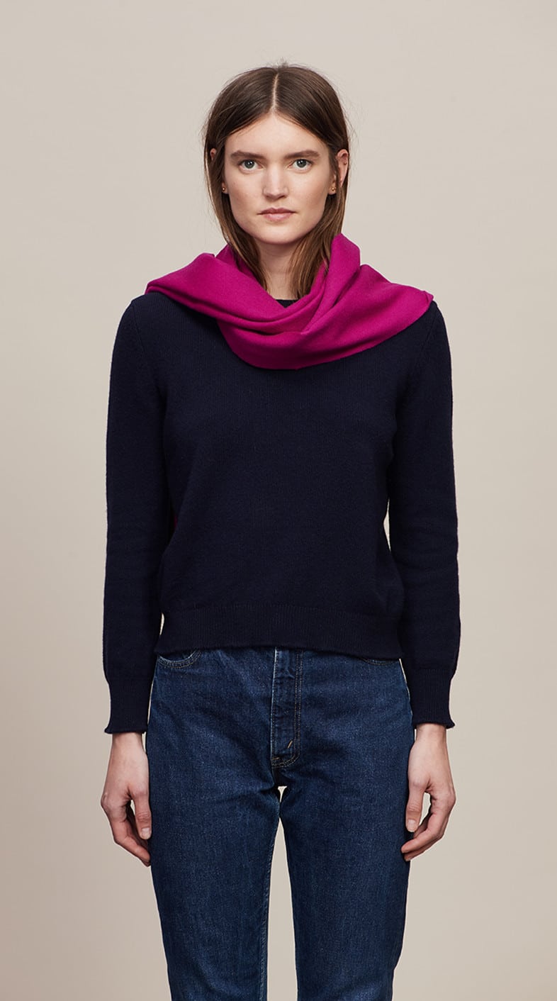 Model wearing a Fuchsia Classic Cashmere Scarf over a black sweater - custom suits nyc bespoke tailor midtown, noho